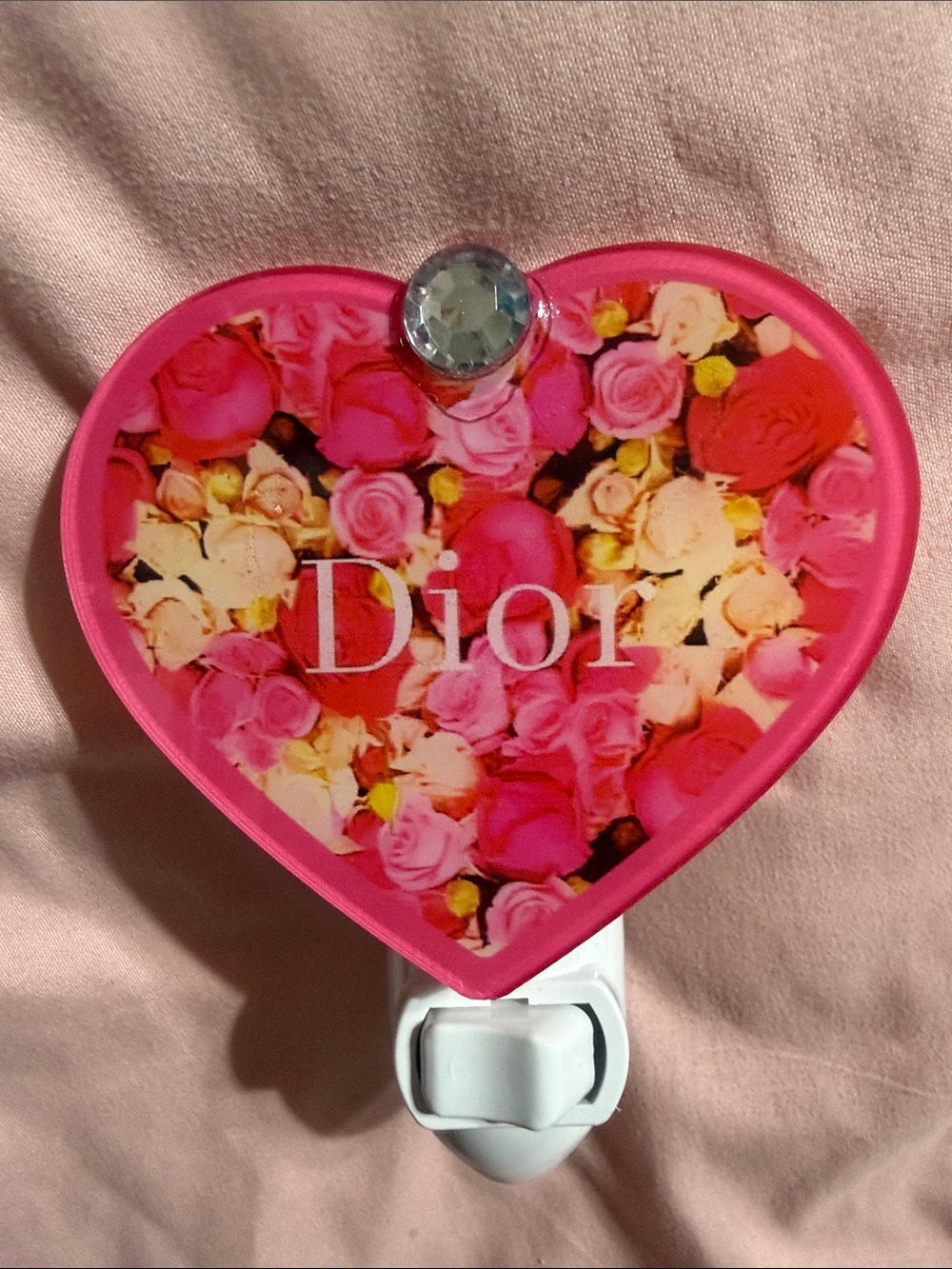 Pink floral heart plug in night light.  Does not include bulb.
